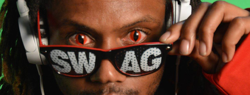 Joseph Mekael Page sporting his swag glasses while posing at the Little Green Studios photo shoot; Photo turned into a banner.