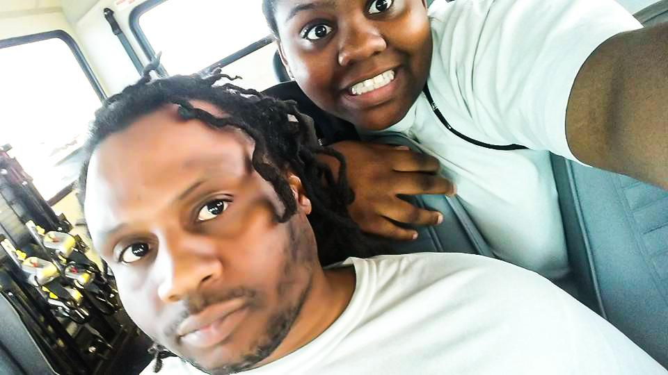 Joseph Mekael Page smiling with his daughter in a candid father–daughter photo, representing family, redemption, and restored relationship.